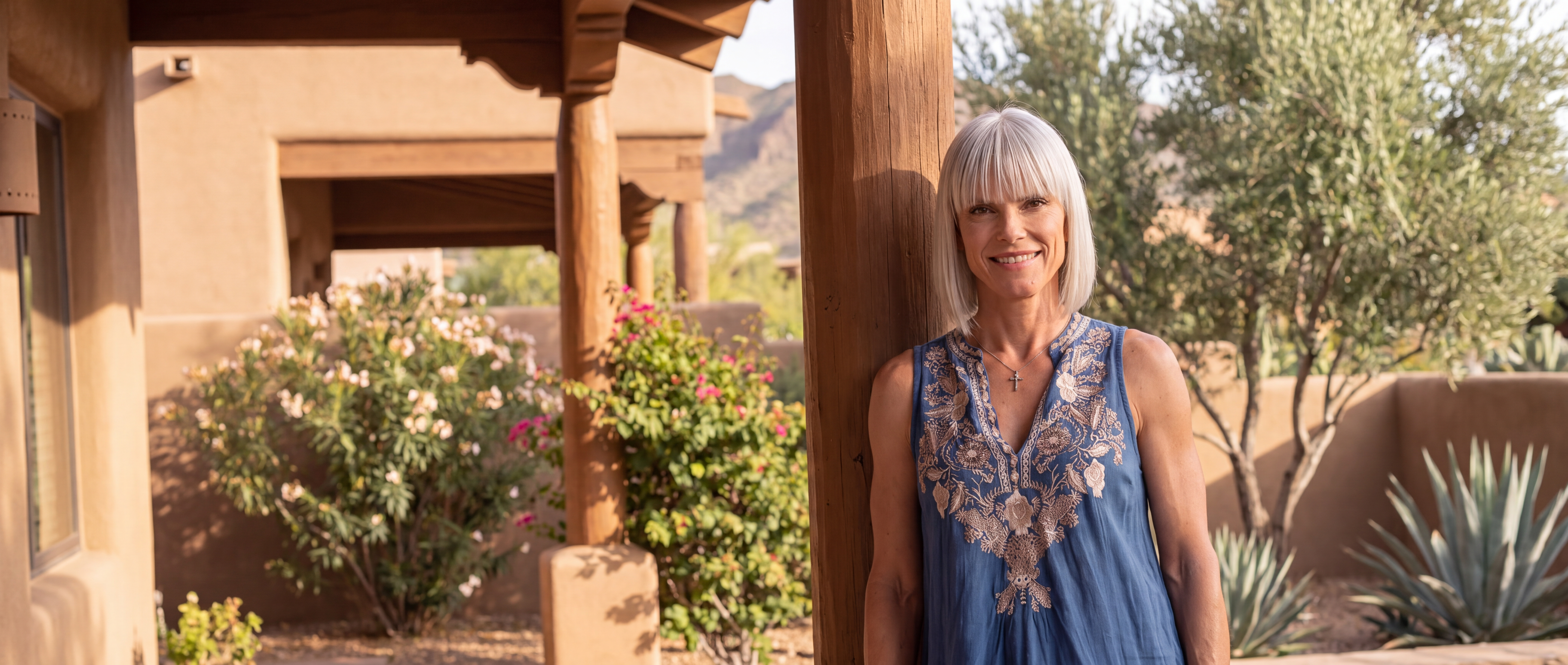Amie Davidson leaning against a porch post at her home in Scottsdale, Arizona